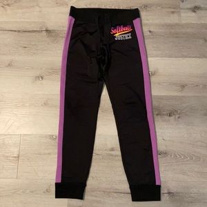 Joggers, with words softball justice